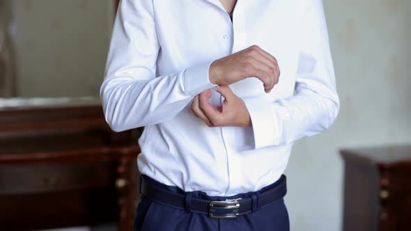 Businessman Buttoning Buttons on Shirt Sleeves Closeup