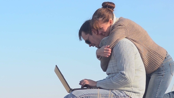 The Man And The Woman With The Laptop