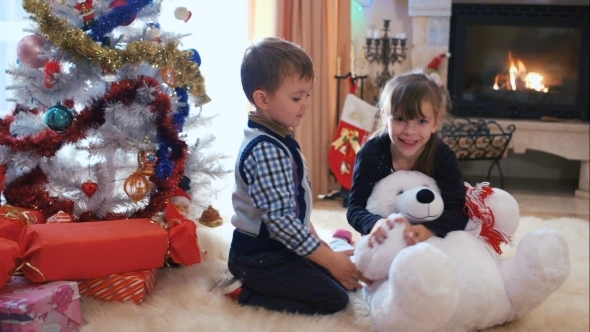 Children Fooling Around Near The Christmas Tree alt