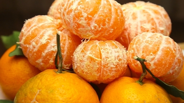 Rotating Tangerines With Leaves