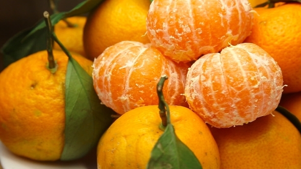 Rotating Tangerines With Leaves