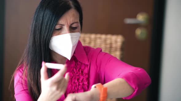 Woman Holding a Rapid Serological Testing Kits for COVID19 Pandemic Waiting the Result