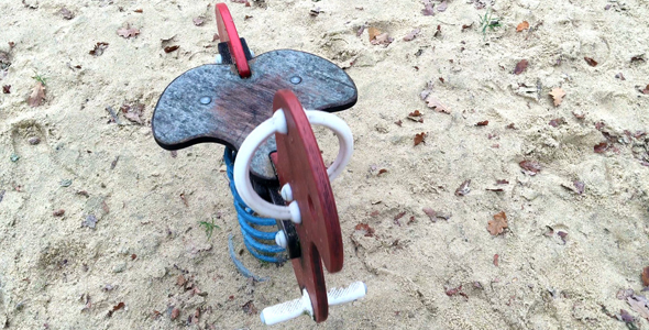 Wooden Cockhorse in Playground Park and Soil