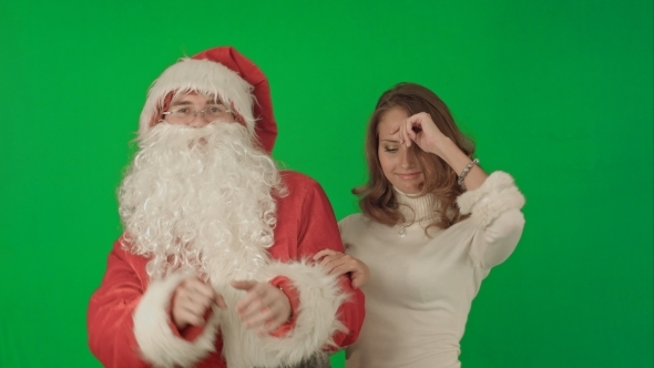 Beautiful Christmas Woman Dancing With Santa Claus