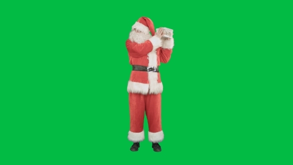 Happy Santa Claus Carrying Gifts On a Green Screen
