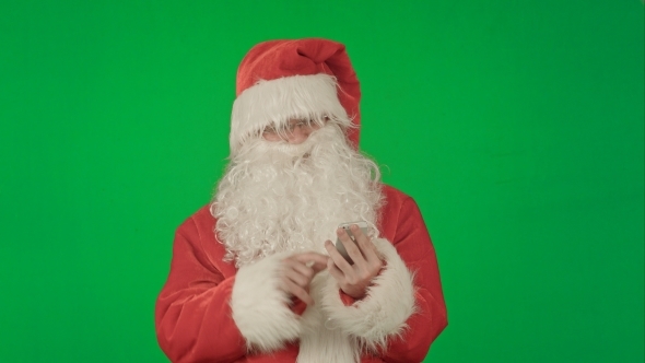 Santa Claus Reads And Sends Text Messages From His