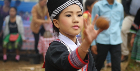 Hmong Kid Playing A Ball