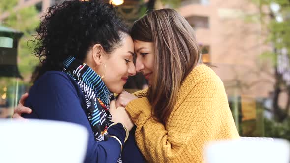 Lesbian couple having a coffee together