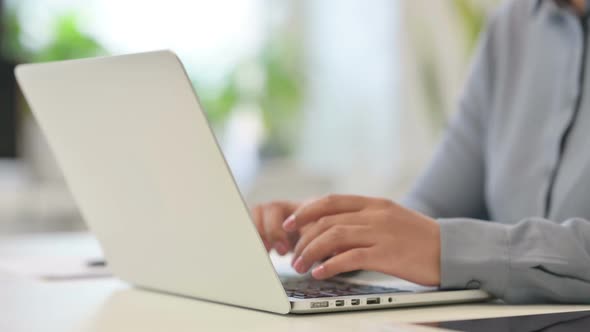 Close Up of African Woman Using Laptop Showing Thumbs Up