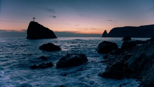 Cross On a Rock In The Sea