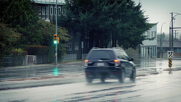 Cars Passing In The Rain On Overcast Day