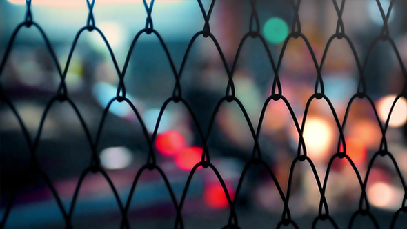 City Nightlife Through Fence Abstract