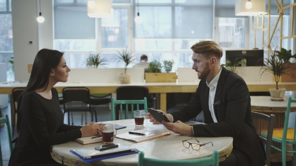 Business Couple  At The Meeting. 