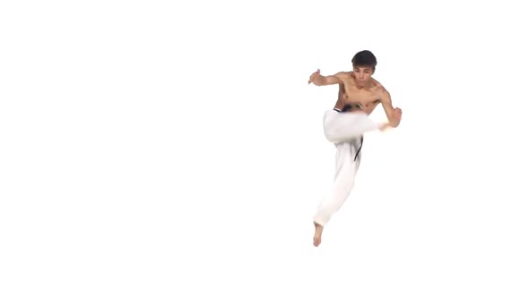 Karate or Taekwondo Makes a Somersault Through Itself. Slow Motion