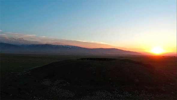 Aerial Flight Above Ancient Mound