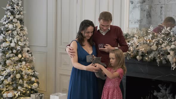 Happy Family of Tree with Kitten in Christmas Day