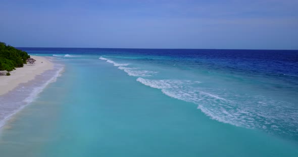 Tropical birds eye abstract view of a white sandy paradise beach and aqua turquoise water background