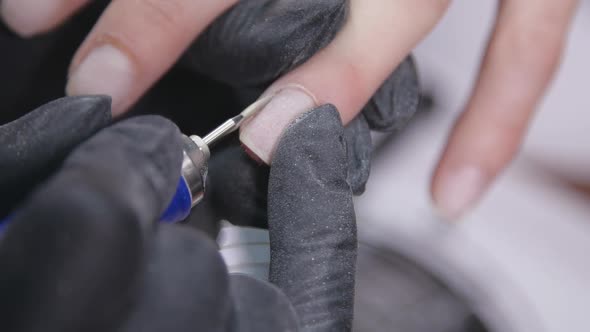 Closeup Slow Motion Shot of Hardware Manicure in a Beauty Salon