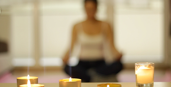 Yoga Meditation Behind Candles