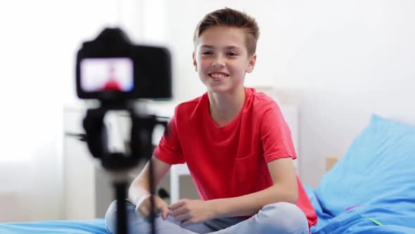 Happy Boy with Camera Recording Video at Home