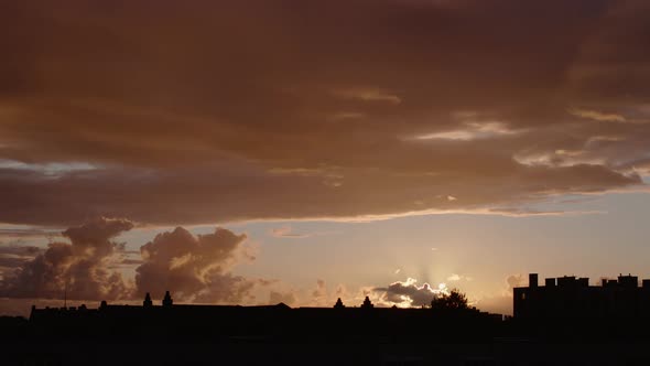 Time lapse, silhouette of city buildings at sunset