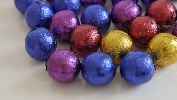 Colorful Christmas chocolate treats slow tilt 3840X2160 UltraHD footage - Assorted round candies clo