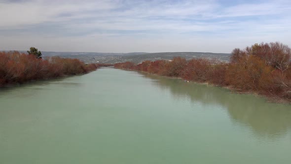 Big Turquoise River in the Middle of the Large Plain