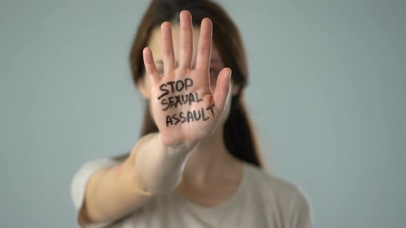 Stop Sexual Assault Message on Bruised Womans Palm, Problem Awareness Prevention