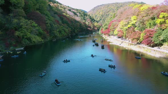 Katsura river at autumn and boats. Arashiyama, Kyoto, Japan