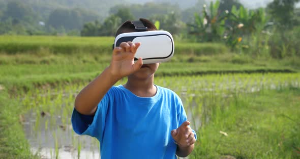 Rural Boy Wears a VR Headset