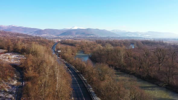 The National Park Surrounded By Mountains and a Raging River Aerial View