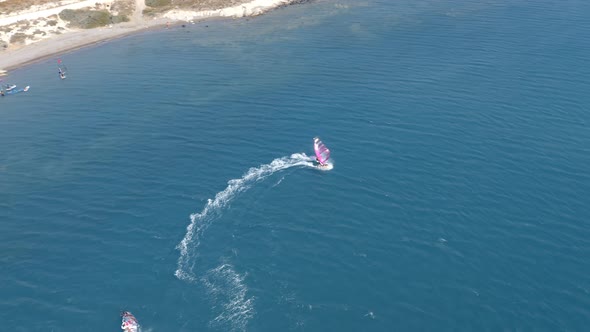 Windsurfers In Blue Ocean