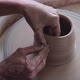 A Woman Sculptor Works on a Potter's Wheel - VideoHive Item for Sale