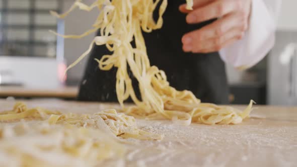 Chef separating pasta