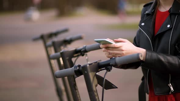 Woman Rents One of Four Electric Scooters