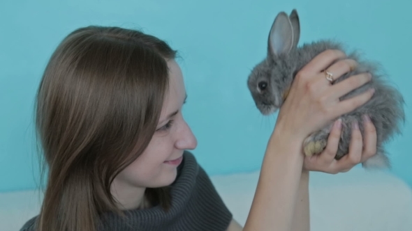 Woman Holding Little Cute Rabbit