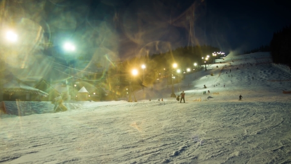 Night Skiing At The Ski Slopes And Snow Cannons