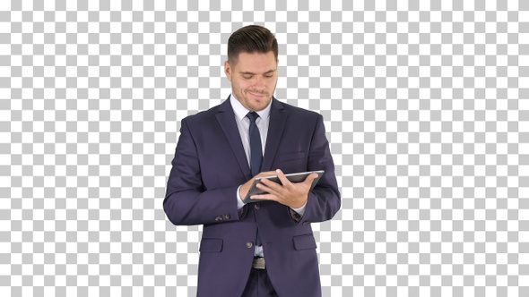 Man in suit walking and using digital tablet, Alpha Channel