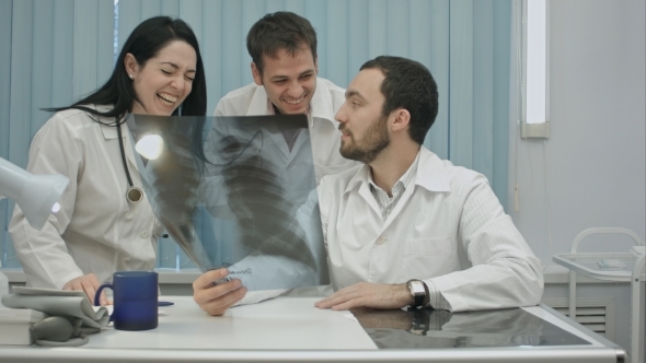  Laughing Doctors Studying X-ray