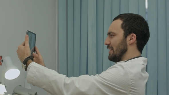 Male Doctor Taking Selfie, Smiling