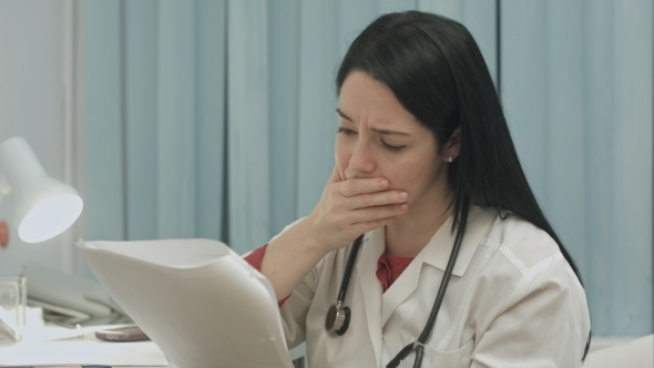 Female Medical Doctor Seriously Watching Test
