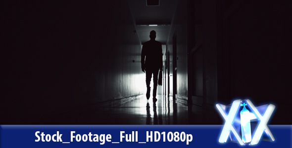 Businessman In Dark Hallway