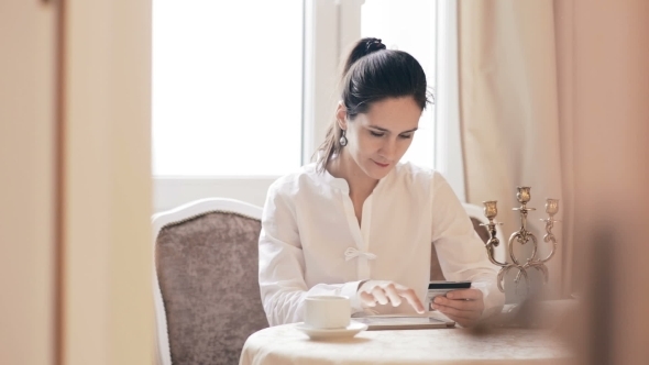 Woman Shopping Online With Tablet Computer 