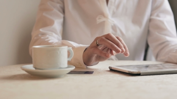 Woman Shopping Online With Tablet. Through Glass