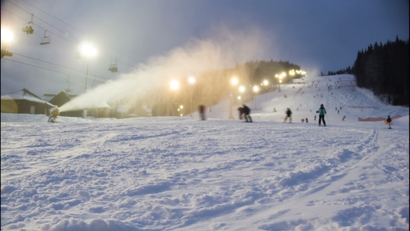 Night Skiing At The Ski Slopes And Snow Cannons