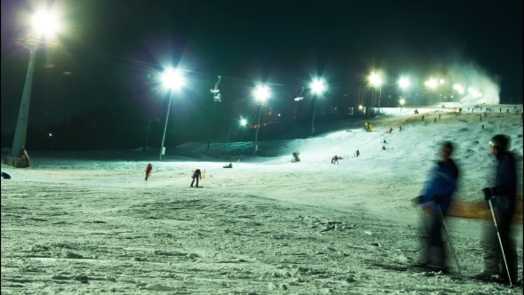 Night Skiing At The Ski Slopes And Snow Cannons