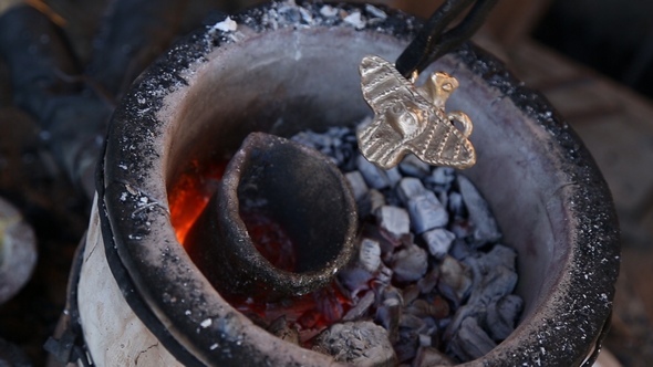 Blacksmith Holding Tongs Made Medallion