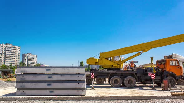 Unloading Concrete Plates By Crane at Road Construction Site Timelapse