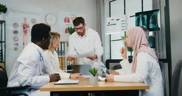 Main Doctor Quarreling His Silent Frightened Diverse Male and Female Coworkers for Bad Made Work