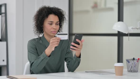 African Woman Excited By Online Shopping on Smartphone